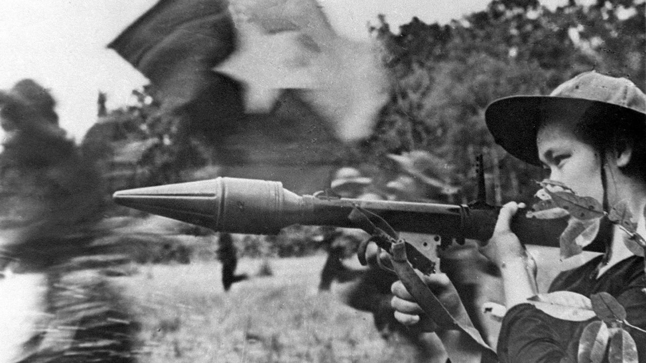 A Viet Cong soldier holds an anti-tank gun during the Tet Offensive, a massive surprise attack launched in 1968 by the North Vietnamese. The attack hit 36 major cities and towns in South Vietnam. Both sides suffered heavy casualties.