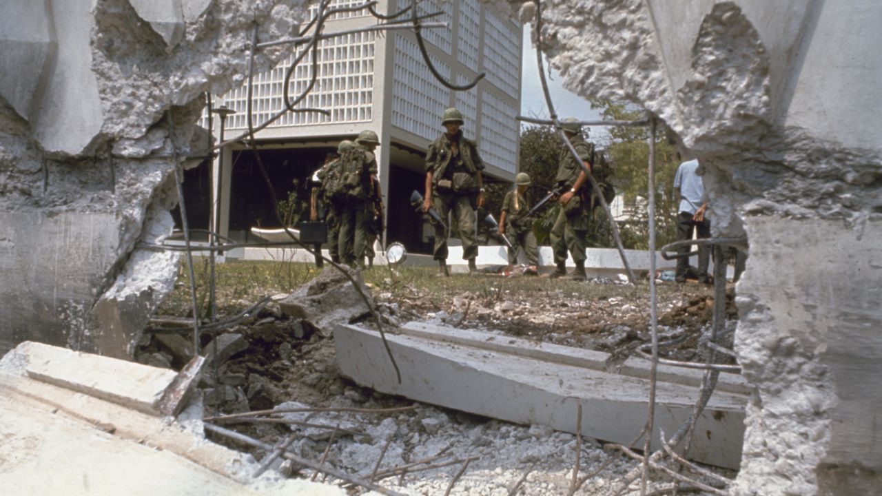 Troops look at the aftermath of an attack on the U.S. Embassy in Saigon in 1968.
