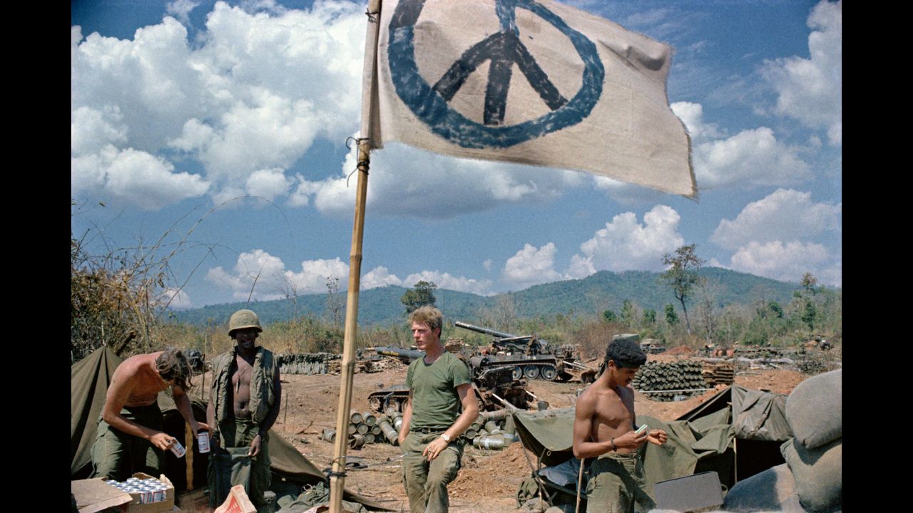 U.S. artillerymen relax under a crudely made peace flag at the Laotian border in 1971. In February 1971, U.S. and South Vietnamese troops invaded southern Laos in an effort to stop North Vietnamese supply routes. This action, ordered by President Nixon, was done without consent of Congress, and it led to more anti-war protests.