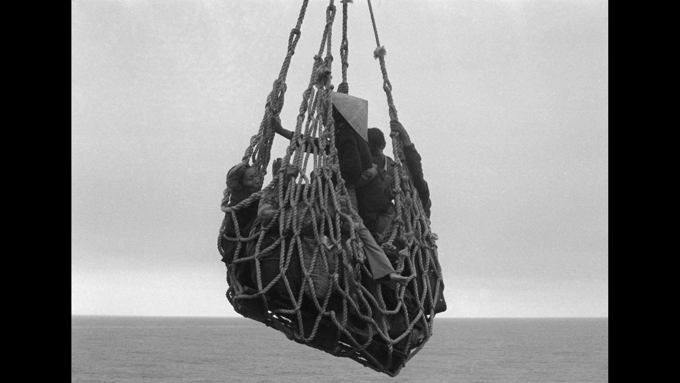 A cargo net lifts refugees from a barge so they can be evacuated from the city of Da Nang, Vietnam, on April 1, 1975.
