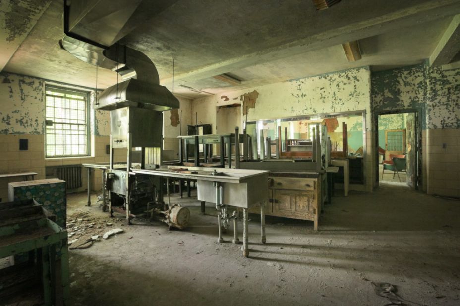 Tables, chairs, and kitchen appliances remain in the cafeteria of Creedmoor Psychiatric Center's Building 25.