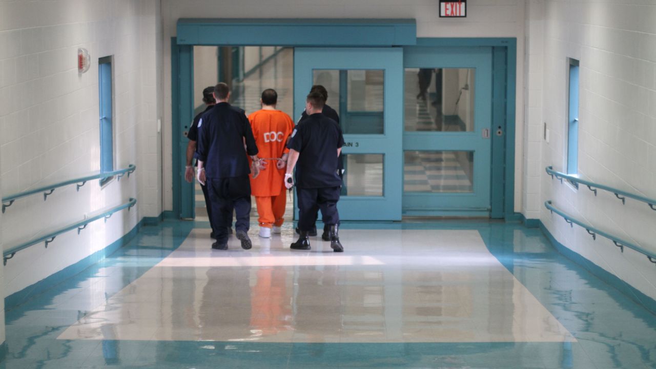 This is how Hernandez, convicted of first-degree murder, is likely to be handled by guards inside prison. Corrections officers move an inmate in leg shackles and handcuffs at Souza-Baranowski.