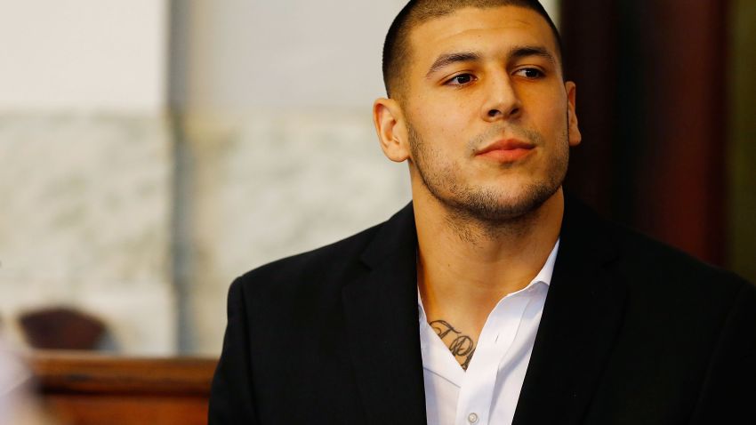 NORTH ATTLEBORO, MA - AUGUST 22: Aaron Hernandez sits in the courtroom of the Attleboro District Court during his hearing on August 22, 2013 in North Attleboro, Massachusetts. Former New England Patriot Aaron Hernandez has been indicted on a first-degree murder charge for the death of Odin Lloyd. (Photo by Jared Wickerham/Getty Images)