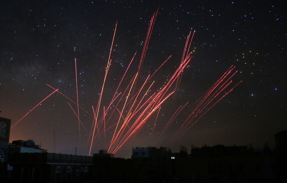 The sky over Sanaa, Yemen, is illuminated by anti-aircraft fire during a Saudi-led airstrike on Friday, April 17. The coalition's warplanes have been carrying out strikes against Houthi rebels since President Abdu Rabu Mansour Hadi fled the country in late March.