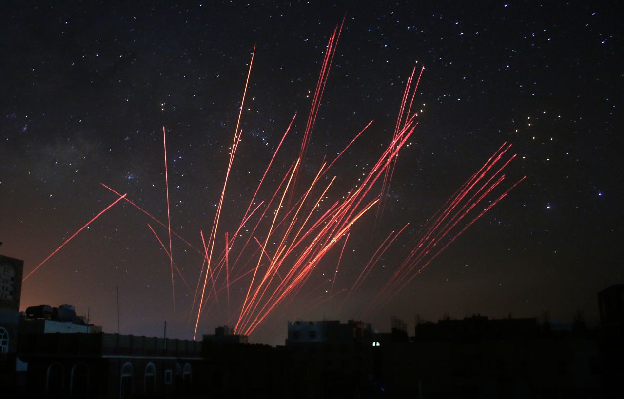 The sky over Sanaa, Yemen, is illuminated by anti-aircraft fire during a Saudi-led airstrike on Friday, April 17. The coalition's warplanes have been carrying out strikes against Houthi rebels since President Abdu Rabu Mansour Hadi fled the country in late March.