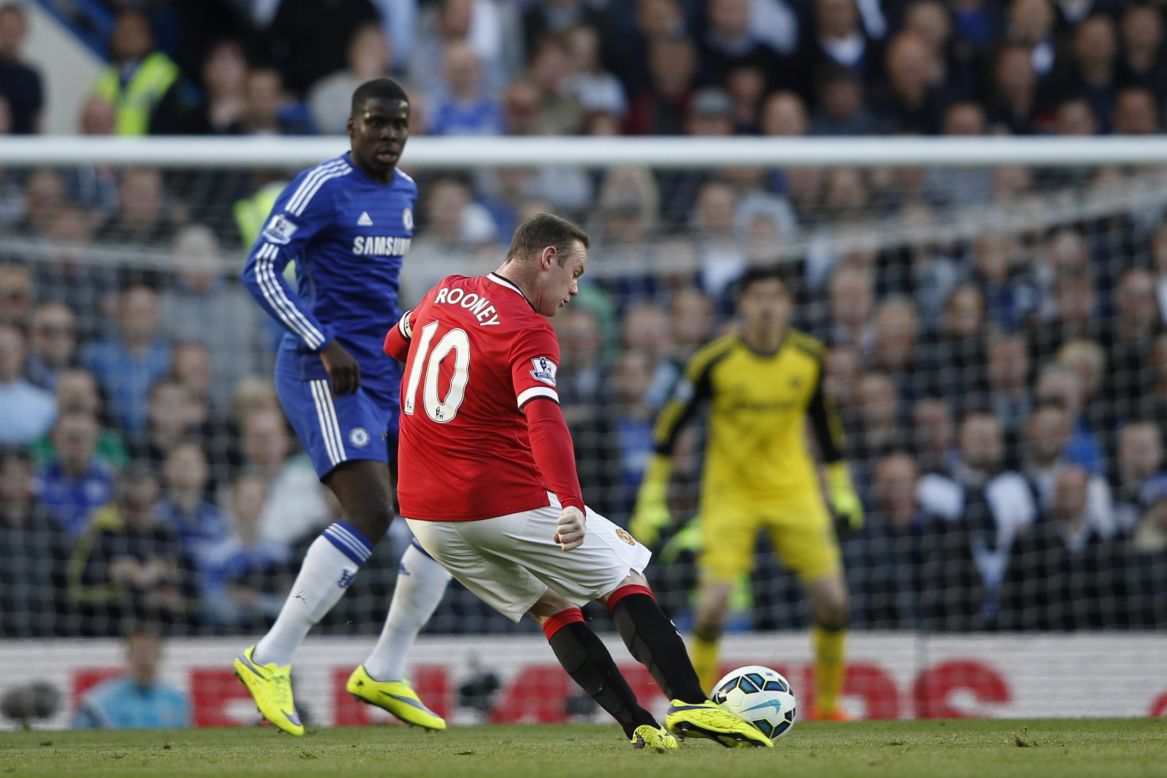 Wayne Rooney lines up a long range effort as Kurt Zouma approaches.