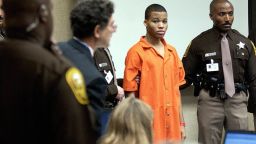 VIRGINIA BEACH, UNITED STATES:  (FILES) Sniper suspect Lee Boyd Malvo (C) is escorted by deputies as he is brought into court to be identified by a witness during the murder trial for sniper suspect John Allen Muhammad in courtroom 10 at the Virginia Beach Circuit Court 22 October, 2003, in Virginia Beach, Virginia. A Cheasapeake, Virginia jury started deliberations 17 December in the murder trial of Malvo, the teenage sniper suspect who could face the death penalty if convicted of one of10 fatal shootings that terrorized the Washington area. Malvo, who was a 17 year-old minor at the time of the crimes was tried as an adult.  AFP PHOTO/Getty Images-Davis Turner/POOL  (Photo credit should read DAVIS TURNER/AFP/Getty Images)