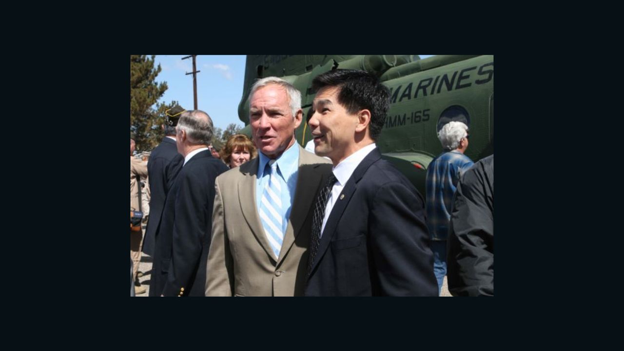 Retired Marine pilot Col. Gerry Berry, left, stands with Quang Pham, who became a Marine pilot himself after Berry evacuated him from South Vietnam at 9. 