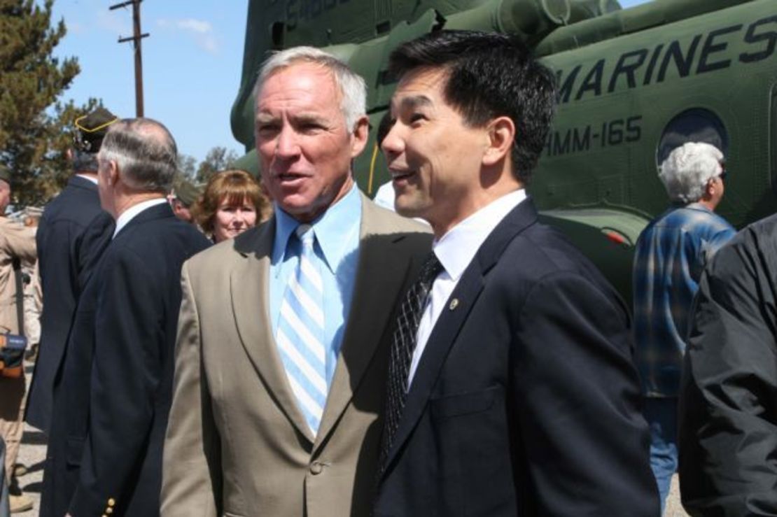 Retired Marine pilot Col. Gerry Berry, left, stands with Quang Pham, who became a Marine pilot himself after Berry evacuated him from South Vietnam at 9. 