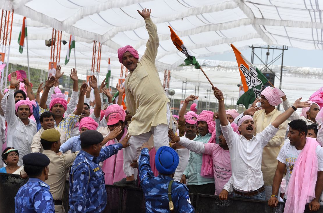 Indian Congress Party supporters shout slogans during a rally against a new land bill in Delhi on April 19, 2015.