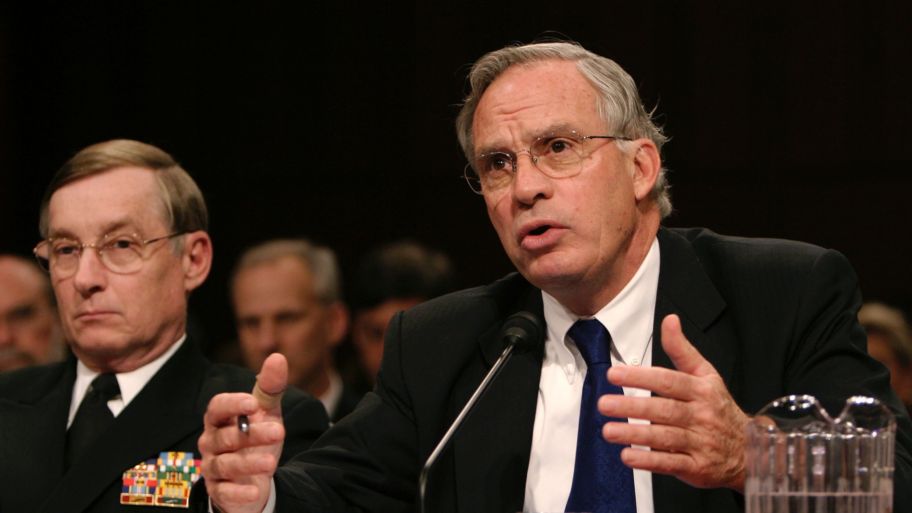 CIA Director Porter Goss (R) testifies before the Senate Select Intelligence Committee as Defense Intelligence Agency Director Lowell Jacoby (L) looks on at the Hart Senate Office Building on Capitol Hill February 16, 2005, in Washington, DC. (Photo by Shaun Heasley/Getty Images)