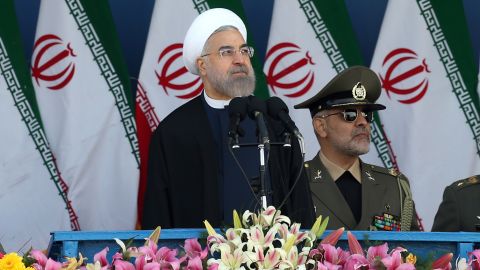 Iranian President Hassan Rouhani reviews the parade April 18.