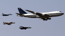 Iranian Air Force jets -- a MIG-29, from left, a F-4 "Phantom" and a F-14 "Tomcat" -- escort a Boeing 747 plane as they perform a fly-over during the parade.