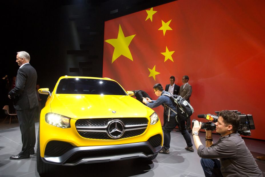 Journalists take photos and video of the Mercedes Benz concept GLC Coupe unveiled ahead of the Shanghai Auto Show.