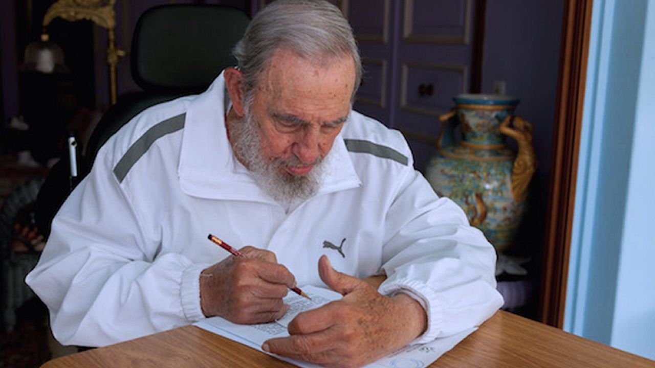 Handout picture released by Cuban official website www.cubadebate.cu, showing former Cuban president Fidel Castro voting during local elections held throughout Cuba, on April 19, 2015 in Havana. Cubans voted Sunday in local elections featuring two opposition candidates who could become the island's first non-Communist elected officials in decades. 