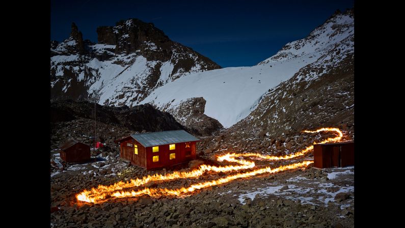 Nigeria-born landscape photographer Simon Norfolk traced fire across Mount Kenya to show how far the mountain's colossal Lewis Glacier has receded. Norfolk used very long exposures and "<a href="http://www.wired.com/2015/04/simon-norfolk-when-i-am-laid-in-earth/" target="_blank" target="_blank">a piece of rolled up gasoline-soaked carpet attached to a rake</a>" to mark where the edge of the glacier -- which has already shrunk by 90% -- once stood. 