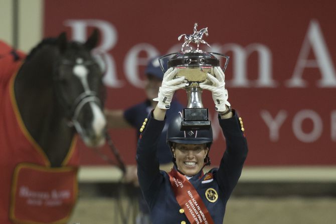 Designed by New York fashion designer Reem Acra the trophy features a leather belt and silver equestrian buckle.