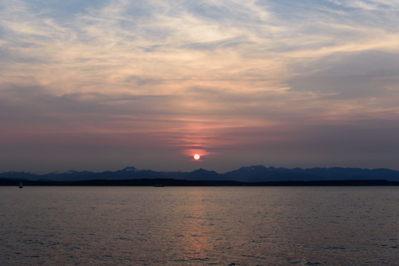 Tim Durkan noticed the fiery sunsets, and photographed them from different spots round Seattle. 