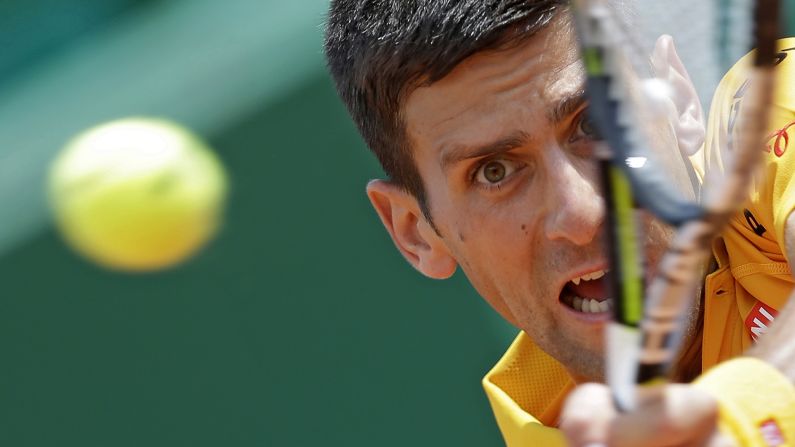 Novak Djokovic plays a shot Friday, April 17, during a quarterfinal match at the Monte Carlo Masters in Monte Carlo, Monaco. Djokovic would go on to win the tournament and <a href="index.php?page=&url=http%3A%2F%2Fwww.cnn.com%2F2015%2F04%2F19%2Ftennis%2Ftennis-djokovic-wins-monaco%2F" target="_blank">become the first man</a> to win the opening three Masters tournaments of the season. Djokovic also won the Australian Open earlier this year.
