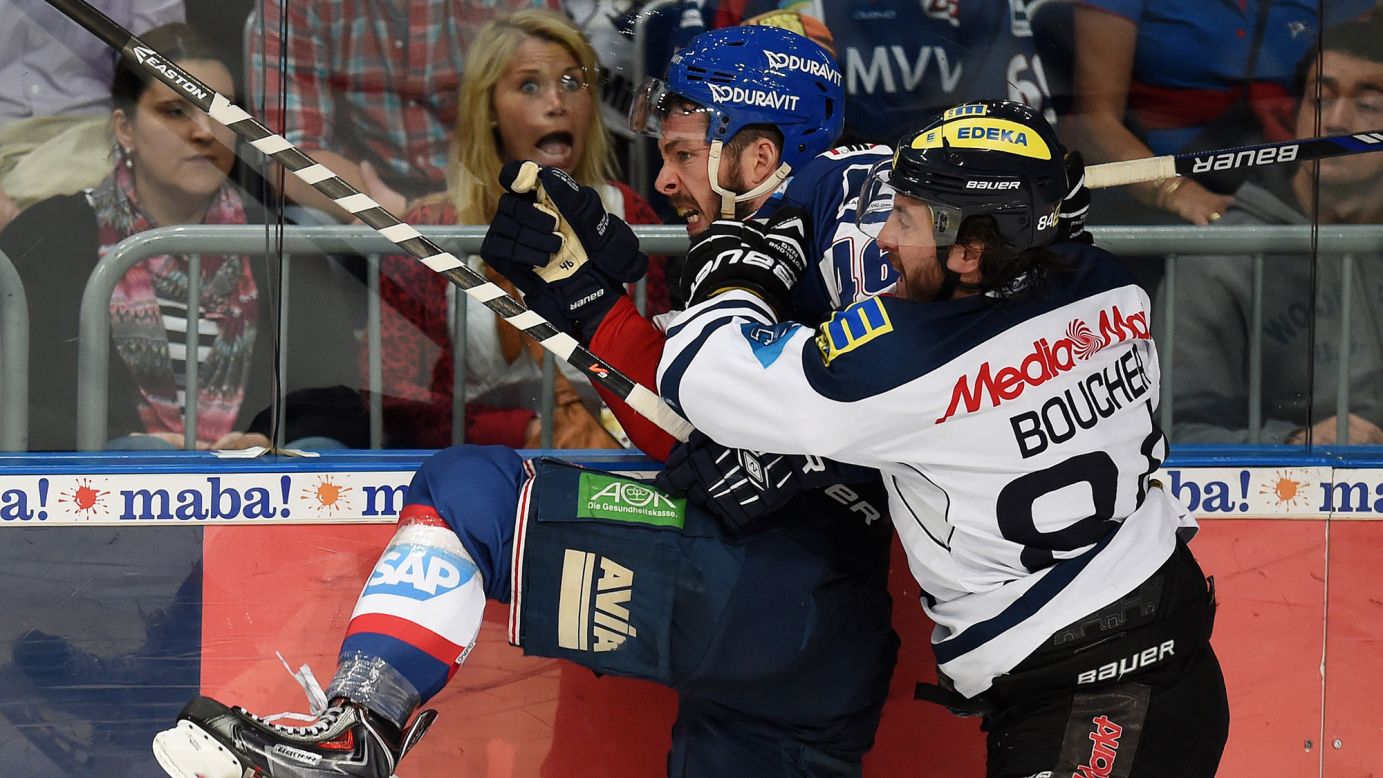 Ingolstadt's Jean-Francois Boucher checks Mannheim's Jonathan Rheault on Tuesday, April 14, during Game 3 of the German league playoff finals. Ingolstadt won the away game 6-1.