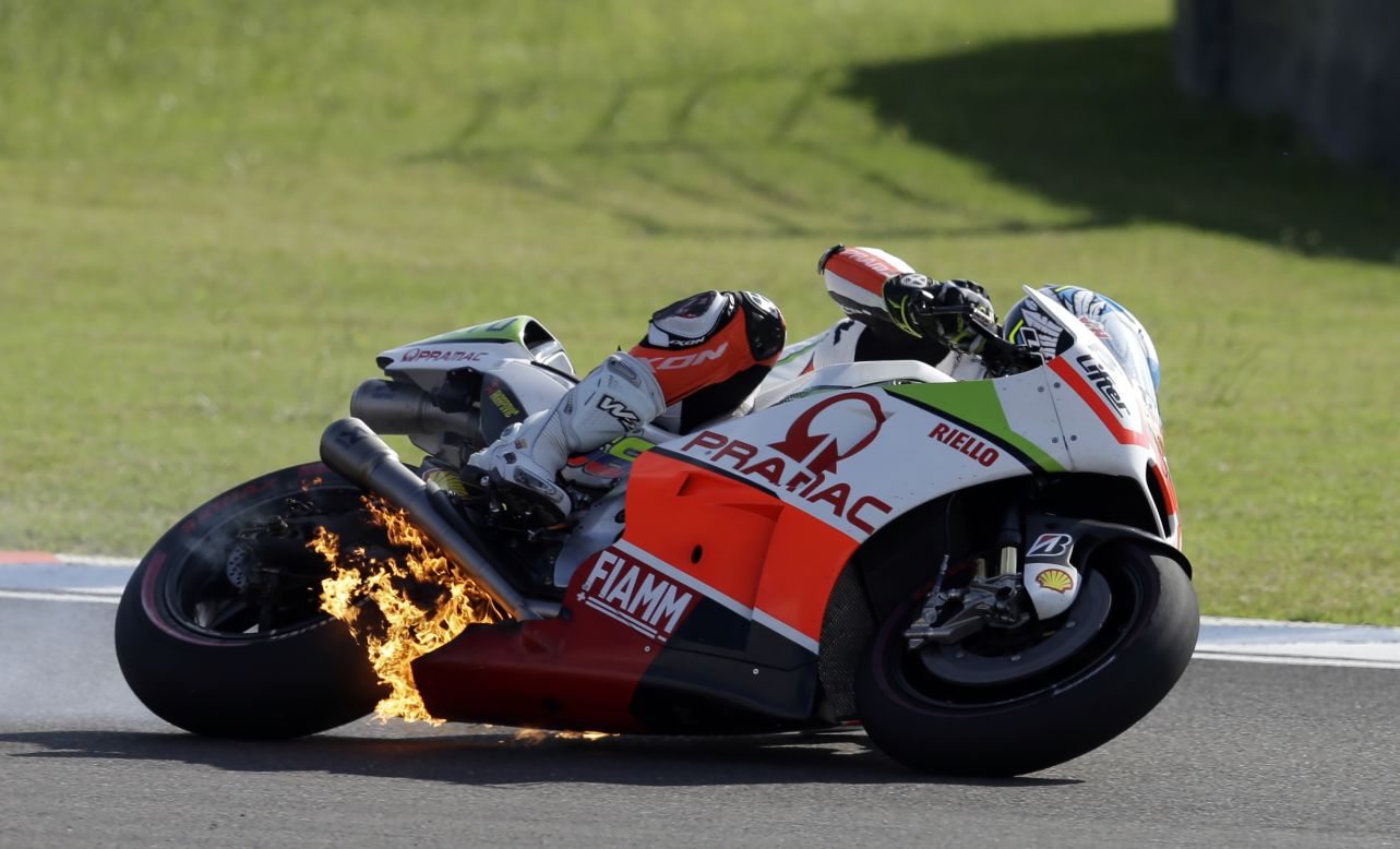 The engine of Yonny Hernandez's motorcycle bursts into flames during the MotoGP race in Argentina on Sunday, April 19. The mechanical issue forced Hernandez out of the race.