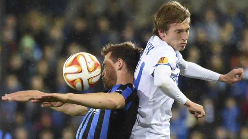 Club Brugge's Tom de Sutter, left, and Dnipro's Valeriy Luchkevych, right, collide during a Europa League quarterfinal match on Thursday, April 16. The match in Bruges, Belgium, ended scoreless. The second leg will be played in Dnipropetrovsk, Ukraine.