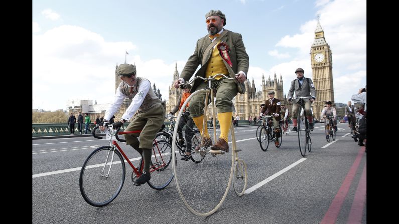 Participants in the Tweed Run ride their bicycles over London's Westminster Bridge on Saturday, April 18. The Tweed Run is an annual event in which people wear vintage clothing and ride their bicycles though city centers worldwide.