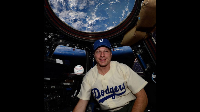 NASA astronaut Terry Virts honors legendary baseball player Jackie Robinson as he wears a Robinson jersey <a href="index.php?page=&url=https%3A%2F%2Finstagram.com%2Fp%2F1gGn5JoaDR%2F%3Ftaken-by%3Dnasa" target="_blank" target="_blank">aboard the International Space Station</a> on Wednesday, April 15.