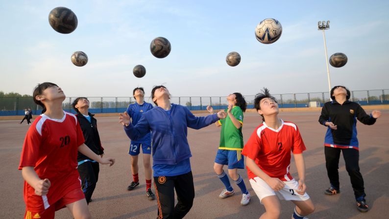 Girls practice soccer skills at a middle school in Handan, China, on Tuesday, April 14.