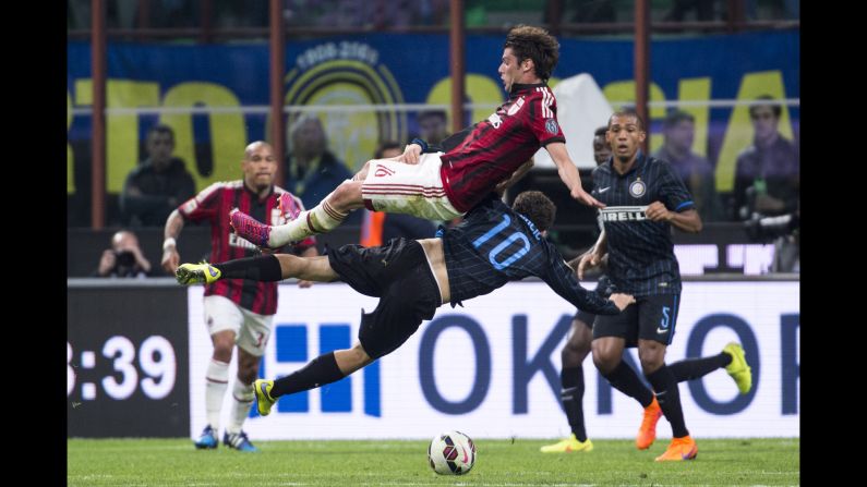 Inter Milan's Mateo Kovacic (No. 10) collides with AC Milan's Andrea Poli during an Italian league match on Sunday, April 19. The match ended 0-0.