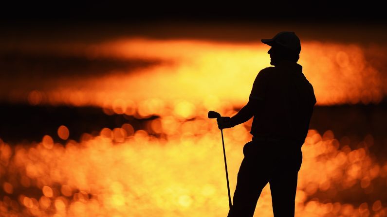 A silhouette of pro golfer Felipe Aguilar is seen Thursday, April 16, as he plays in the first round of the Shenzhen International in Shenzhen, China.