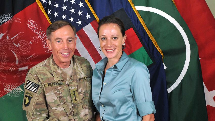 In this handout image provided by the International Security Assistance Force (ISAF), former Commander of International Security Assistance Force and U.S. Forces-Afghanistan; CIA Director Gen. Davis Petraeus, left, shakes hands with biographer Paula Broadwell, co-author of 'All In: The Education of General David Petraeus' on July 13, 2011.