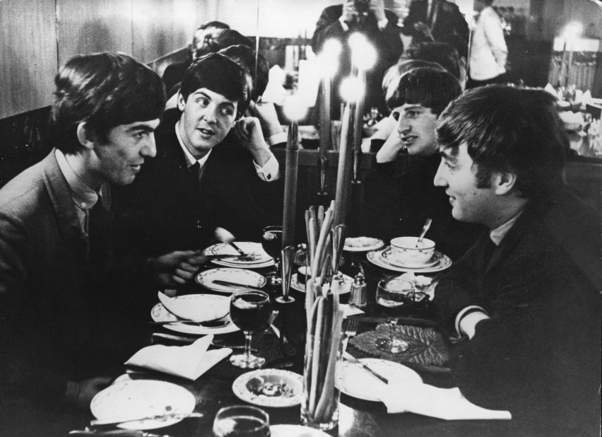 The Beatles meet for the first time after their holidays by candlelight at the Star Steak House in Shaftsbury Avenue, London in 1963. This evening they appear on 'Ready, Steady, Go', the British music television program.