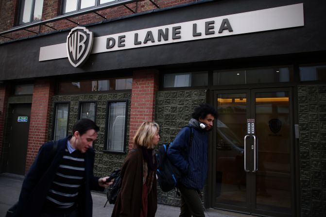 People walk past the offices for De Lane Lea media company in Soho on January 16, 2015 in London, England. Soho is the epicenter of the UK's world-class film and television post-production industry. Famously, companies in the area worked on Oscar-winner "Gravity" and the "Harry Potter" franchise.