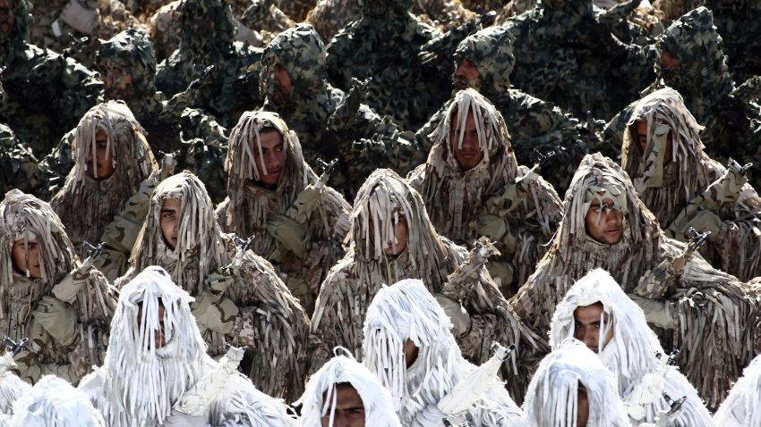 Iranian soldiers wearing ghillie suits, a type of camouflage designed to resemble heavy foliage, march during the annual military parade marking the anniversary of Iran's war with Iraq (1980-88) in Tehran, on September 22, 2014. Iran is a cornerstone of stability in the Middle East in the face of the 'terrorists' rocking the region, President Hassan Rouhani said before leaving for the United Nations. AFP PHOTO/ BEHROUZ MEHRI (Photo credit should read BEHROUZ MEHRI/AFP/Getty Images)