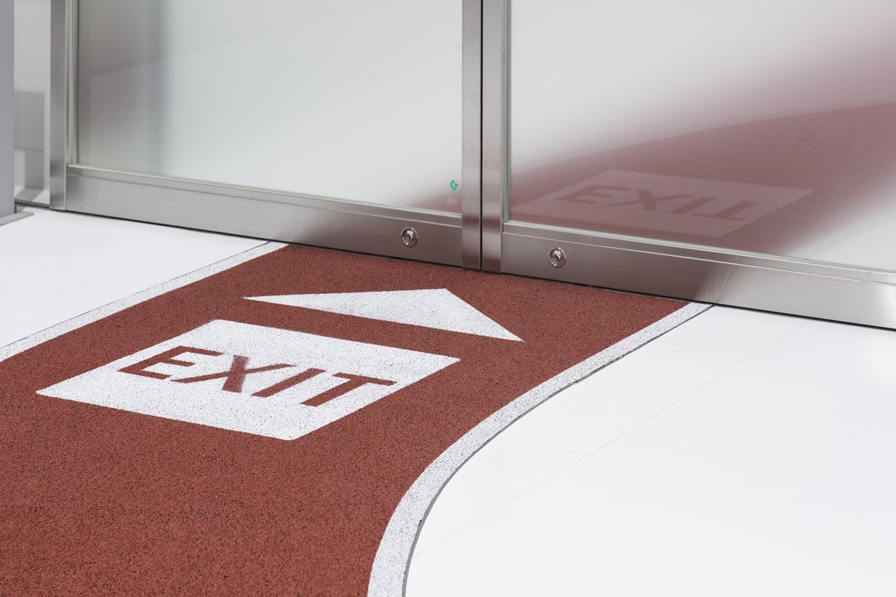 "The earth-colored running tracks express the sense of relief when people finally land in Japan after a long journey. The idea is to use these two colors as user-friendly signs to guide people."