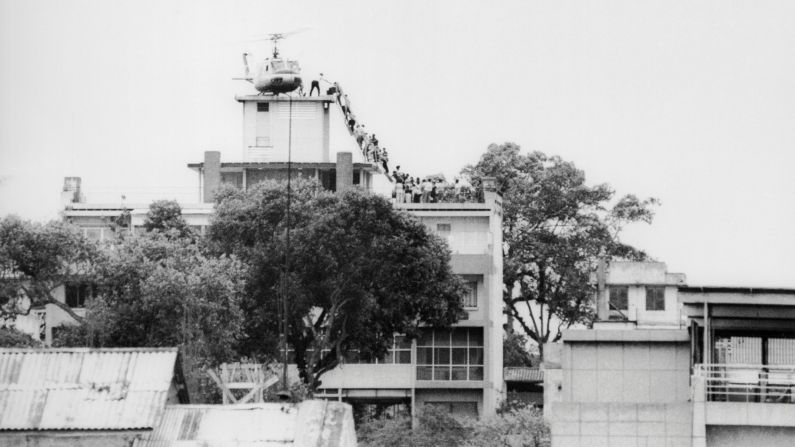 A CIA employee helps Vietnamese evacuees onto a helicopter near the U.S. Embassy in Saigon on April 29, 1975. Near the war's end, about <a href="index.php?page=&url=http%3A%2F%2Fwww.cnn.com%2F2015%2F04%2F29%2Fus%2Fvietnam-saigon-evacuation-anniversary%2Findex.html">100 Marine, Air Force and Air America choppers evacuated an estimated 7,000 Americans and South Vietnamese</a> out of the South Vietnamese capital in under 24 hours. It was the largest helicopter airlift in history.