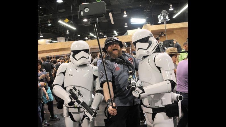 A man takes a selfie with Stormtroopers during a "Star Wars" celebration Thursday, April 16, in Anaheim, California.