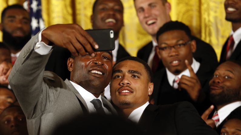 Hall of Fame football player Cris Carter takes a selfie with Ohio State wide receiver Jalin Marshall after a White House ceremony honoring the Buckeyes on Monday, April 20. Carter once played for Ohio State, which won the first-ever college football playoff earlier this year.
