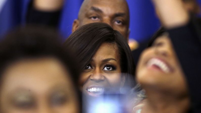 Michelle Obama, the first lady of the United States, poses for a selfie on Monday, April 20, after speaking at a New Orleans event honoring efforts to help homeless veterans.