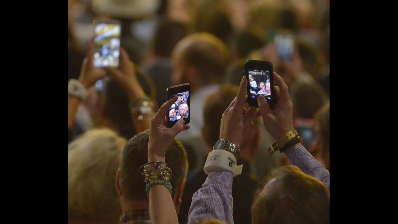 Fans take selfies during the Academy of Country Music Awards, which took place Sunday, April 19, in Arlington, Texas.
