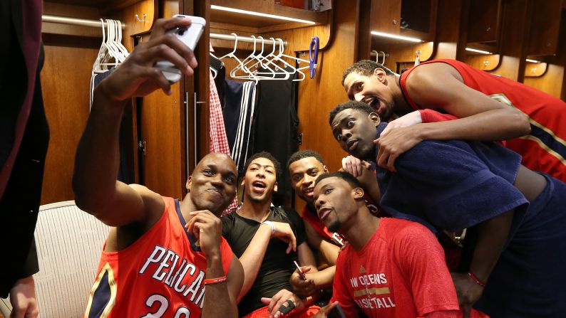 The New Orleans Pelicans celebrate their NBA playoff berth with a locker room selfie on Wednesday, April 15.