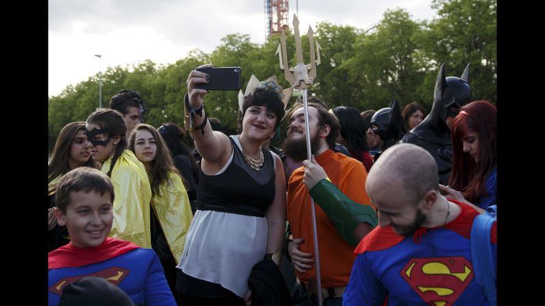 Fans dressed as superheroes from DC Comics take a selfie Saturday, April 18, in San Martin de Valdeiglesias, Spain.