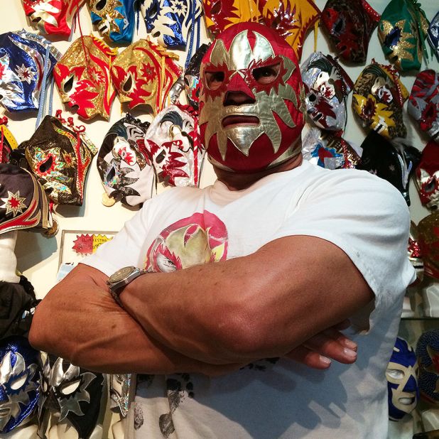 Legendary luchador Solar I is seen here  in his mask and trophy room. Solar, a champion luchador, has been wrestling for 40 years and his real identity has never been revealed. Solar's son is now continuing the family legacy, wrestling as Solar Jr. "The characters are passed down from generation to generation, a lot of times from father to son, and those characters are kept alive through the masks," Parks says.