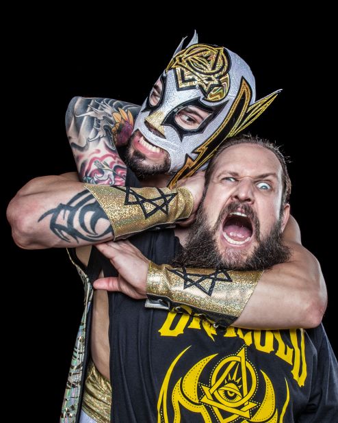Artist Chris Parks getting "attacked" by one of his Luchadors, Oraculo. "The mask is the luchador's identity, both in and out of the ring. Luchadores will keep their faces and real names a secret throughout their entire lives; some of the more iconic luchadores have even been buried in their mask," Parks said.