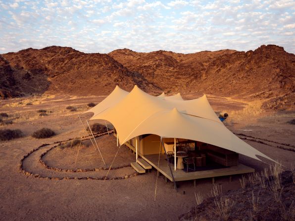 Listed in the Remote and Wild category, this camp of eight luxury tents serviced by a private plane is described by CN Traveler as an "African game changer."