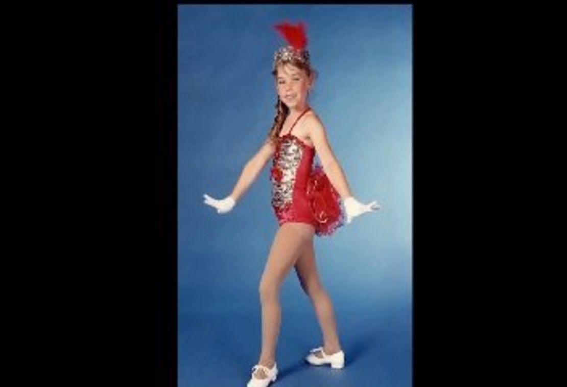 A young Krystle Campbell appears dressed in a tap dancing costume.