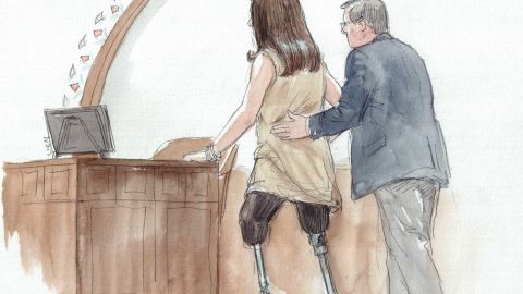 Celeste Corcoran, who lost both her legs in the Boston Marathon bombing, approaches the witness stand to testify in the sentencing phase of Dzhokhar Tsarnaev's trial.