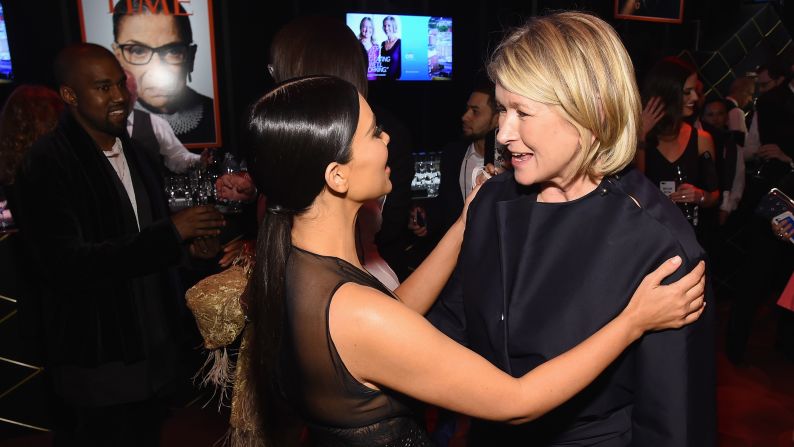 Kim Kardashian, left, greets Martha Stewart. 
