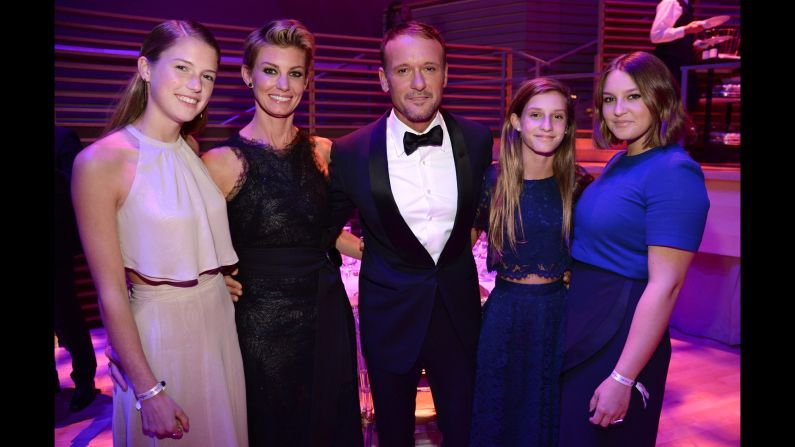 Country-music duo Faith Hill and Tim McGraw attend with their daughters, from left: Gracie McGraw, Audrey McGraw and Maggie McGraw.